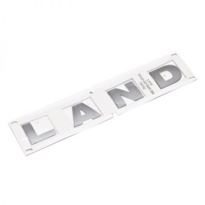 DAB500290 - Напис на капоті Defender - Spells LAND - Оригінальний предмет Land Rover